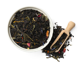 Dry tea leaves in bowl and scoop isolated on white, top view