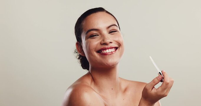 Woman, beauty or lip gloss on face with kiss, confidence or color cosmetics in studio. Lipstick, female person or pout on white background space with makeup, happiness or hydration treatment for care