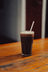 coffee and food placed on wood table 