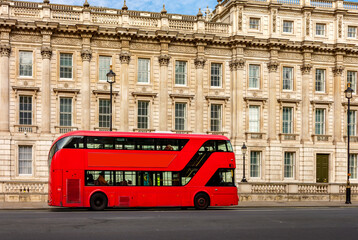 Red double-decker bus on Whitehall street, London, UK