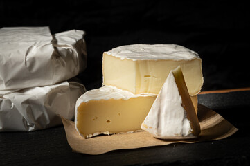 Delicious creamy brie cheese! Perfect for food photography, recipes, or showcasing gourmet dairy products. Available in wrapped and cut portions