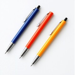 Fototapeta premium Three Colorful Ballpoint Pens Arranged Neatly on a White Background for Creative Projects and Stationery Needs