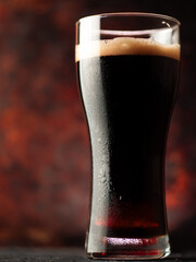 Stout cold beer glass close-up. dark craft beer