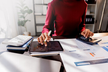 Fototapeta premium Business accountant or financial expert analyze business report graph and finance chart at corporate office. Concept of finance economy, banking business and stock market research.