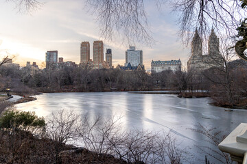 The serene beauty of a frozen lake in Central Park, Manhattan, NYC on January 30, 2025, surrounded by the New York City skyline.