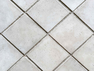 Close up of concrete tiles with intricate diamond patterns and textures