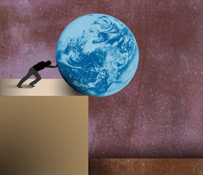 Man pushing planet earth over the edge