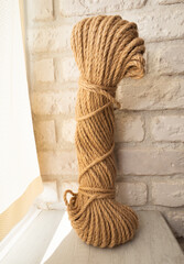 A coil of rope for a cat, a rope for a scratching post.