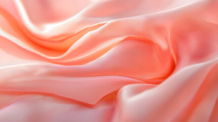 Obraz premium Soft pink silk fabric draped elegantly on a smooth surface for textile and fashion design