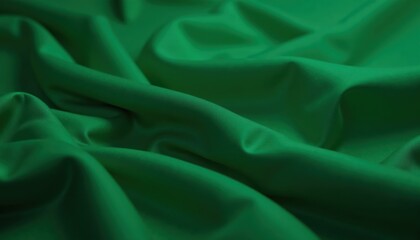 Fototapeta premium Close-up smooth flowing folds of satin fabric in emerald green, Green Screen
