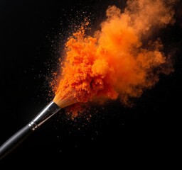 Makeup Brush with Orange Powder Explosion on Black Background
