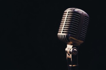 Vintage Microphone Against Dark Background Captures Nostalgic Auditory Experience