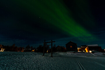 Aurora Borealis - Northern Lights - over frozen lake Akaslompolo in Finnish Lapland.