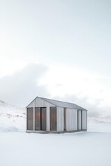 Naklejka premium Modern cabin in a snowy landscape surrounded by mountains during winter, showcasing minimalist architecture and serene isolation