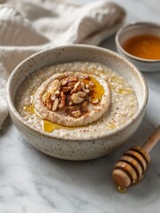 Healthy oatmeal bowl topped with walnuts and honey for a nutritious breakfast