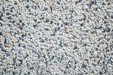 gray background, close-up of a paving stone block