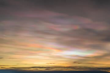 Beautiful winter sunset with rare nacreous clouds known as rainbow clouds in Finnish Lapland.