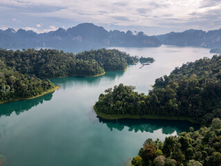 Khao Sok, Thailand: Aerial drone footage of the jungle covered coastline of the Khao Sok lake in southern Thailand Surat Thani province.