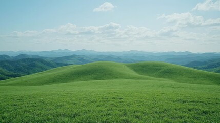 Obraz premium Lush green hills under a clear sky, serene mountain view
