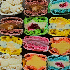 A variety of different macarons. A variety of colors and flavors of French almond dessert