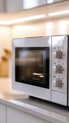 Fototapeta premium White Microwave Oven in Modern Kitchen
