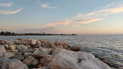 Construction cranes at the Aegean Sea Bay in Athens