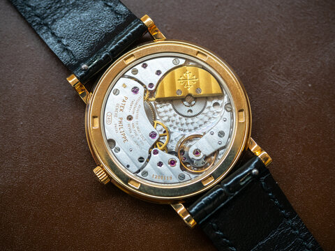 BANGKOK - JANUARY 30 : Patek Philippe Calatrava model 5120, 18k solid gold, white porcelain dial, roman marker, automatic, was taken on brown leather background in Bangkok, Thailand, January 30, 2025 