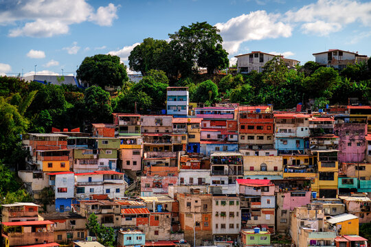 Barrios, slums of on the hillside.
Poor neighborhoods in South America. Caracas, Venezuela. - Powered by Adobe