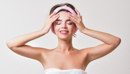 Fototapeta premium Beautiful young woman perfect skin. Healthy woman in towel with perfect skin