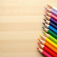 Obraz premium colored pencils on a wooden table