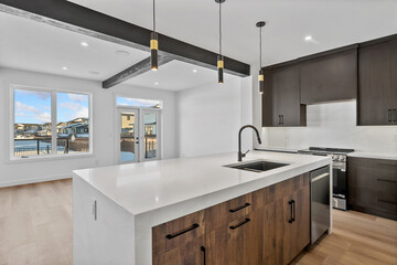 A kitchen with a white counter and a sink