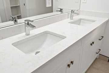 The bathroom is clean and well-maintained, with a white sink