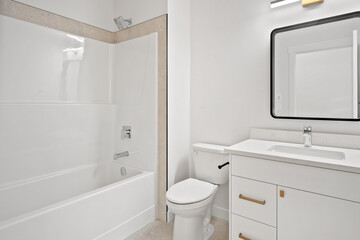 A bathroom with a white toilet and sink