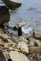 rocks on the beach set among the choppy waves