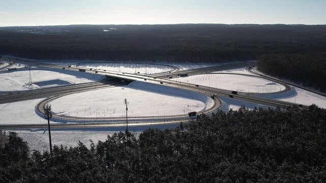 Aerial view of a road junction in a winter landscape. Motorway road junction.
