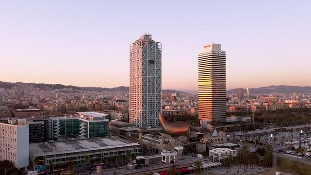 Barcelona, Spain - 5 February 2025: Aerial drone view of Barcelona at sunset. Dusk cityscape near Torre Mapfre and Hotel Arts towers. Sunset skyline. Marina street and Port Olimpic