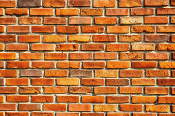 Obraz premium Exterior brick wall texture, close-up view, sunlit