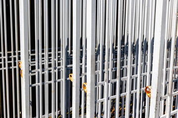 Obraz premium Rusty metal bars with shadows creating geometric patterns