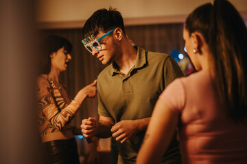 Friends enjoying a lively birthday celebration at home