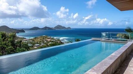 Transparent glass fence surrounding a modern infinity pool with ocean views.
