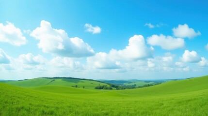 Lush Green Hills Under a Bright Blue Sky with Fluffy Clouds