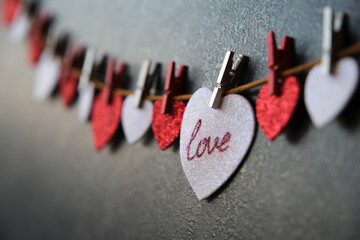 On the heart there is an inscription love next to other hearts