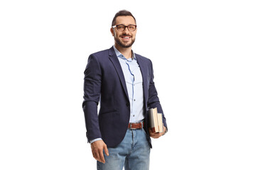 Man with glasses holding books and smiling