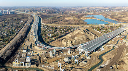 Krakow, Poland. Mistrzejowice interchange under construction. Temporary ramp joining S52 highway ring road, and S7 express road from Warszawa, both opened in December 2024. Aerial view. February 2025