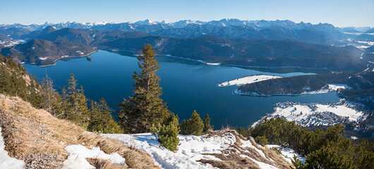 lake Walchensee panorama in march. view from Fahrenbergkopf mountain with some snow