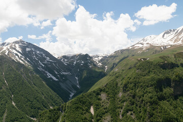 Fototapeta premium the landscape of mountains in Georgia.Snow-capped mountain peaks against a blue sky