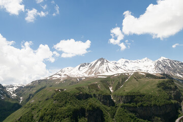 Fototapeta premium the landscape of mountains in Georgia.Snow-capped mountain peaks against a blue sky