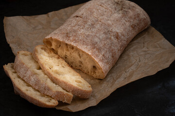 Fresh ciabatta bread on parchment paper