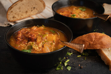Vegan soup in black bowl