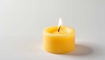 yellow candle on a white background